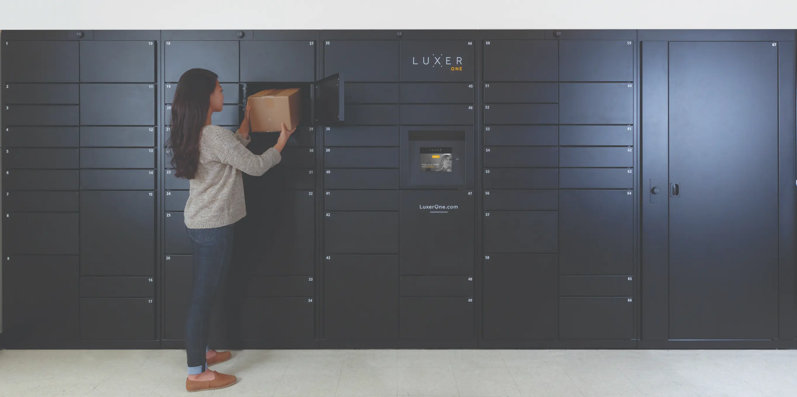 Black package lockers with open oversized delivery compartment and packages inside